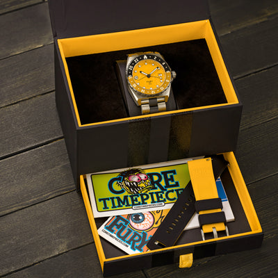 yellow dial watch in packaging